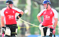 Ian Bell (L) and Andrew Strauss wait to bat in the nets as the team trains in Colombo
