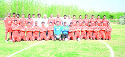 Players and officials from JCT FC pose with the visiting Wolverhampton Wanderers� staff in Hoshiarpur on Friday.
