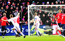 Dennis Rommedahl (L) celebrates after scoring during their Euro 2012 qualifying match in Oslo on Saturday.