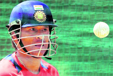 Sachin Tendulkar watches a ball while batting in the nets during a training session at the PCA stadium in Mohali on Tuesday. India face Pakistan in the second semi-final on Wednesday