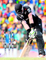 New Zealand�s Martin Guptill is bowled out by Sri Lanka�s Lasith Malinga in Colombo on Tuesday