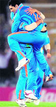 Yuvraj Singh celebrates the wicket of Younis Khan at the PCA stadium in Mohali