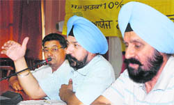 Dr Baldev Singh Baddan (centre), Chief Editor, National Book Trust of India, addresses a press conference in Jalandhar 