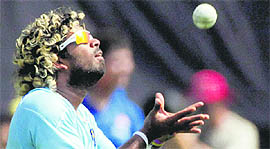 Lasith Malinga catches the ball during a practice session in Mumbai on Friday.
