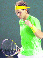 Rafael Nadal celebrates after winning match point against Roger Federer during their semifinal at the Sony Ericsson Open on Friday