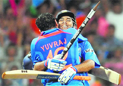 Yuvraj Singh and captain Mahendra Singh Dhoni (R) celebrate their victory in the World Cup final against Sri Lanka at the Wankhede Stadium in Mumbai on Saturday. India defeated Sri Lanka by six wickets to become champions for the second time after 1983