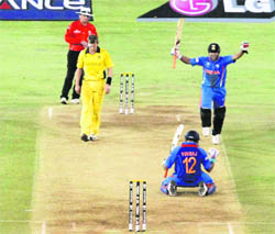 we have done it: Suresh Raina and Yuvraj Singh celebrate hitting the winning runs against Australia in their quarterfinal match in Ahmedabad. India won by 5 wickets.