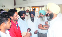 Manpreet Singh Badal, former Punjab Finance Minister and founder of the People�s Party of Punjab, meets party workers at his residence in Chandigarh