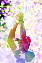 Novak Djokovic celebrates with the trophy after winning the men�s singles at the Sony Ericsson Open on Sunday. 