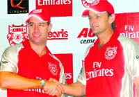 Michael Bevan (L) and Adam Gilchrist of Kings XI Punjab after the official launch of the team for Season 4 at the PCA stadium Mohali on Thursday. 