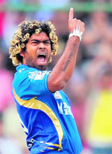 Mumbai Indians� bowler Lasith Malinga reacts after taking the wicket of Delhi Daredevils� David Warner during their match at the Ferozeshah Kotla Stadium in New Delhi on Sunday