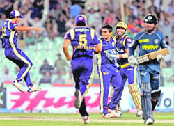 Kolkata Knight Riders� Rajat Bhatia celebrates after dismissing Deccan Chargers� Kumara Sangakara (right) in Kolkata on Monday. Knight Riders won by 9 runs