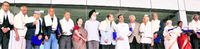 Sports Minister Ajay Maken and Minister of Statistics M S Gill with the 1960 Olympics football team during a function to mark 50 years of the Games in New Delhi on Wednesday