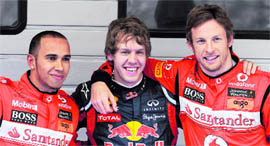 Red Bull�s Sebastian Vettel of Germany (C), McLaren-Mercedes� Lewis Hamilton of Britain (L) and his compatriot Jenson Button celebrate after the qualifying session of the Formula One Chinese Grand Prix at Shanghai on Saturday.