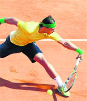 Rafael Nadal hits a return during the final of the Monte Carlo Masters tournament in Monaco on Sunday. Nadal won in straight sets 6-4, 7-5.