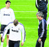 Real Madrid's coach Jose Mourinho (R) during a training session in Madrid on the eve of the King�s Cup final against Barcelona.