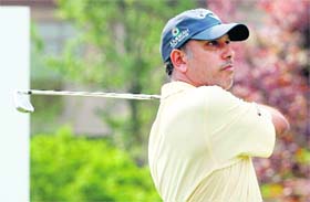 Jeev Milkha Singh plays a shot during the second day at the Volvo China Open golf competition