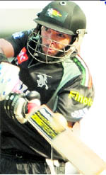 Pune Warriors� Yuvraj Singh hits a boundary against Chennai Super Kings in Mumbai on Wednesday