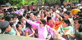 Angry parents with their children protest outside an AIEEE examination centre in Chandigarh on Sunday