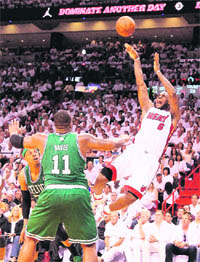 LeBron James #6 of Miami Heat shoots over Glen Davis #11 of Boston Celtics during Eastern Conference Semifinals in Miami on Tuesday.