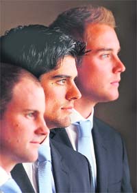 England Test cricket captain Andrew Strauss (L), the new captain of England's one-day international side Alastair Cook (C), and new captain of England's Twenty20 side Stuart Broad pose for photographers in the Long Room at Lord's cricket ground in London on Friday