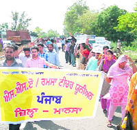 Teachers take out a rally in Gharuan on Friday. 