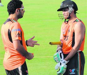Pune Warriors� captain Yuvraj Singh (L) chats with Sourav Ganguly at the Sector 16 stadium in Chandigarh on Saturday