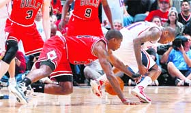 Jamal Crawford (R) of Atlanta Hawks loses the ball to Ronnie Brewer of Chicago Bulls in NBA Playoffs at Phillips Arena in Atlanta on Friday