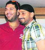 Yuvraj Singh (L) and Harbhajjan Singh at a function in Chandigarh on Monday.