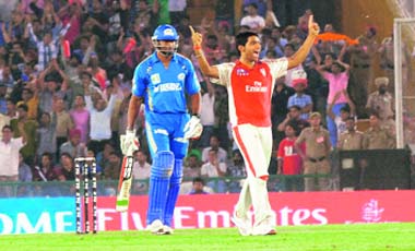 Kings XI Punjab�s Bhargav Bhatt celebrates the wicket of Kieron Pollard in Mohali on Tuesday. Kings XI won the match by 76 runs