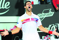Novak Djokovic celebrates after winning the final of the Rome Masters against Rafael Nadal at Foro Italico on Sunday. Djokovic won 6-4, 6-4.