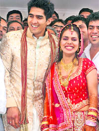 Star boxer Vijender Singh with wife Archana after their wedding at the Delhi Flying Club