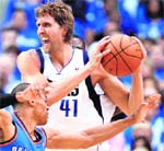 Dirk Nowitzki #41 of Dallas Mavericks and Russell Westbrook of Oklahoma City Thunder in action at American Airlines Center in Dallas
