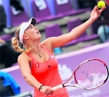 Denmark�s Caroline Wozniacki serves against Francesca Schiavone during the Brussels Open semifinal on Friday.