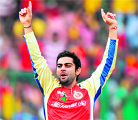 Royal Challengers Bangalore�s Virat Kohli celebrates the wicket of Chennai Super Kings� Wriddhiman Saha at the M. Chinnaswamy Stadium in Bangalore on Sunday. RCB won the match by 8 wickets