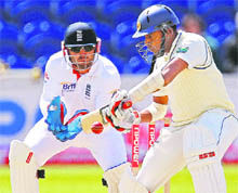 Sri Lankan Thilan Samaraweera cuts on the second day of the 1st Test match against England at Swalec Stadium in Cardiff on Friday