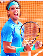 Rafael Nadal reacts after winning a point against Antonio Veic in the third round of the French Open Championship at the Roland Garros Stadium on Saturday.