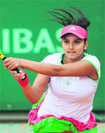 Sania Mirza hits a backhand return in the women�s doubles match in Paris on Sunday. 