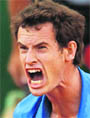Andy Murray reacts during his match against Viktor Troicki in Paris on Tuesday