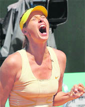 Maria Sharapova reacts after beating Andrea Petkovic during their quarter final at the Roland Garros stadium in Paris on Wednesday. 
