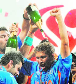 Yuvraj Singh (L) pours champagne on Sachin Tendulkar after India won the 2011 World Cup final in Mumbai. 