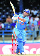 India�s opener Parthiv Patel hits a six off West Indies� Andre Russell during their T20 match at Port of Spain, Trinidad on Saturday.