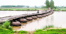 People using the makeshift bridge.
