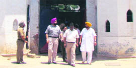 Police officials outside the central jail in Patiala on Sunday.