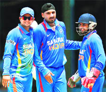 From left: Raina, Harbhajan and Parthiv Patel celebrate fall of a wicket on Monday. 