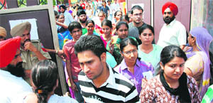 PMET candidates come out of an examination centre in Faridkot.