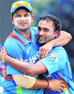 Amit Mishra (R) and Suresh Raina exult at the fall of a wicket. Raina has led the team to two wins against the West Indies and is doing well as captain