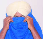 JE Parmjit Singh in police custody. 