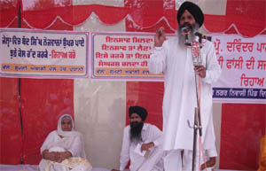 Upkar Kaur, the mother of Devinder Pal Singh Bhullar, sitting on the dais during a function organised at Dyalpura Bhai Ka village on Sunday.