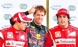 Red Bull�s Sebastian Vettel (C) is flanked by Ferrari�s Fernando Alonso (R) and Felipe Massa after the qualifying session of the Canadian Grand Prix at Circuit Gilles Villeneuve in Montreal on Saturday.